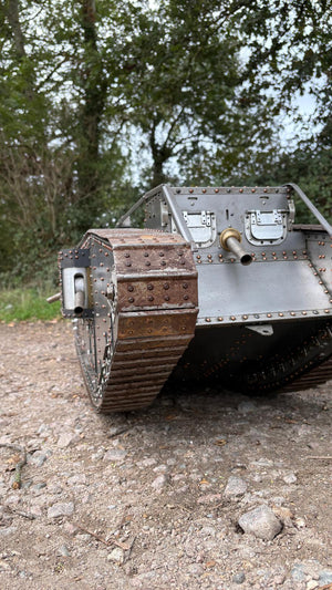 Armortek 1/6 scale WW1 Mark IV tank model, low front view on gravel with trees behind
