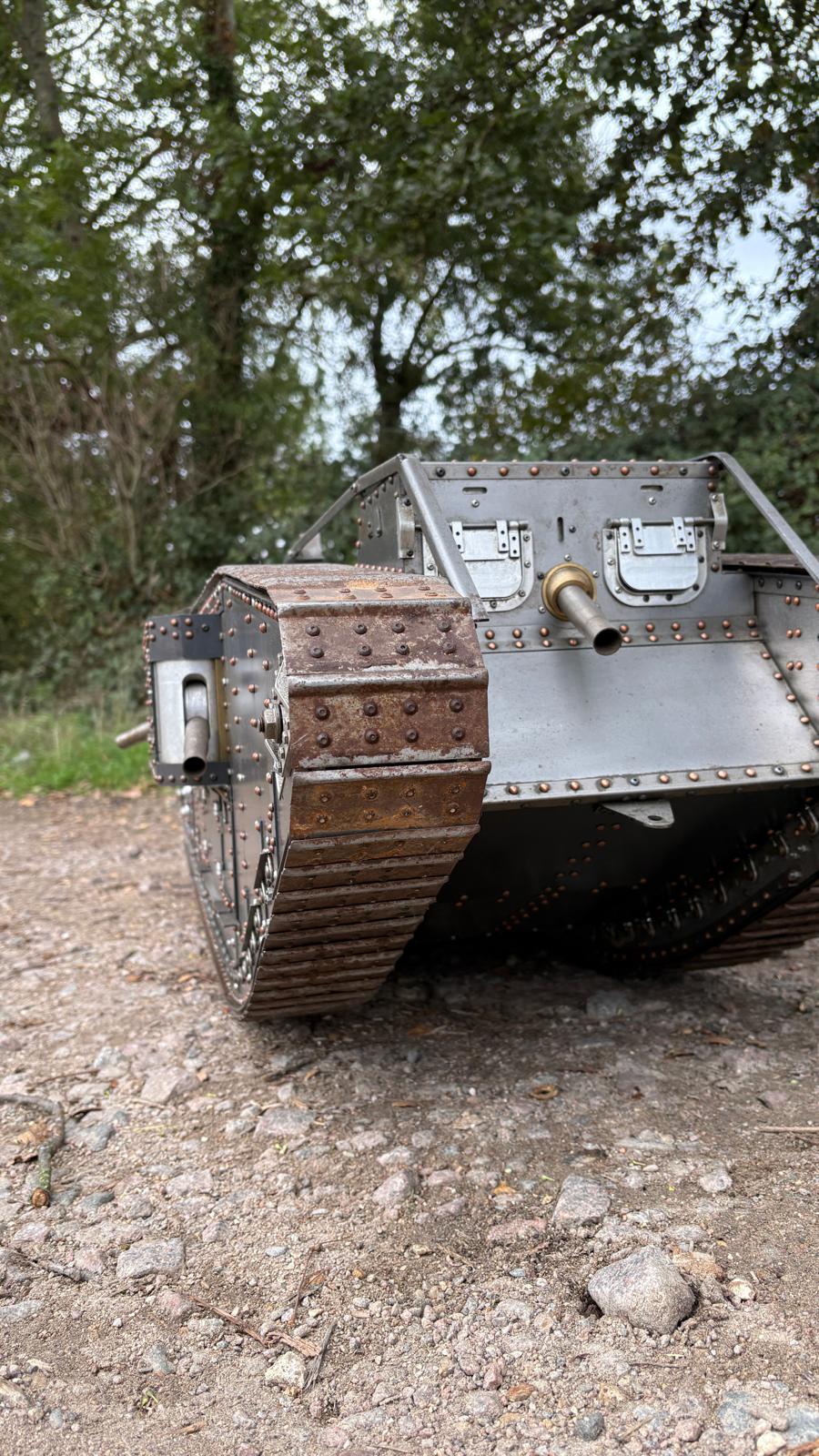 Armortek 1/6 scale WW1 Mark IV tank model, low front view on gravel with trees behind